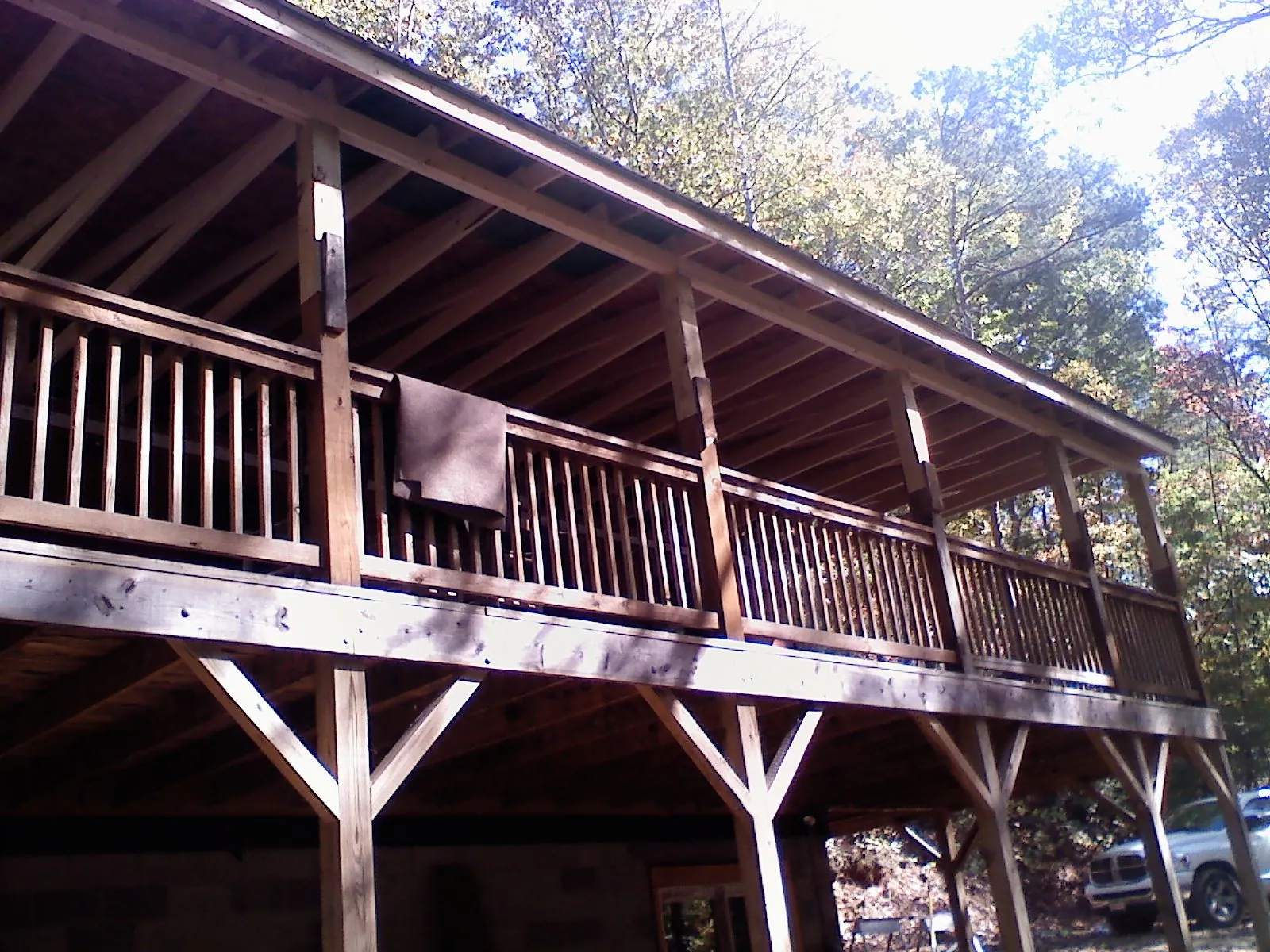 Timber framing under a new elevated porch and deck — Roof Leak Repair in Central Square by Roofing Brothers